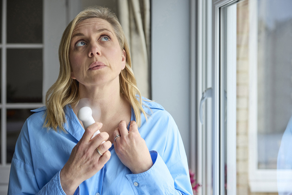 Woman in menopause having a hot flash